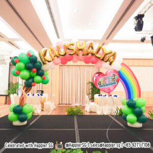 Customised rainbow balloon arch